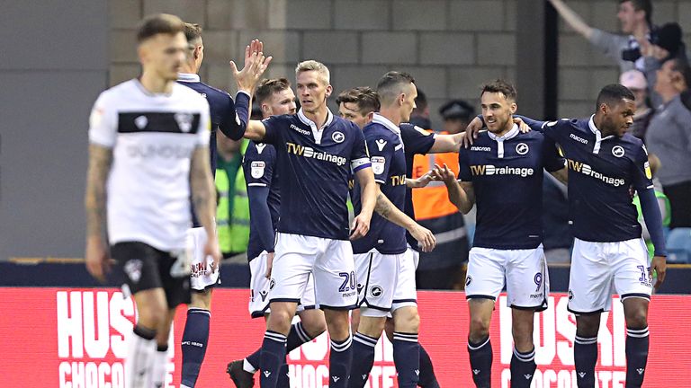 Lee Gregory is congratulated by his team-mates after putting Millwall ahead