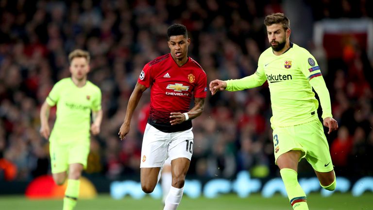 Marcus Rashford battles for possession with Gerard Pique