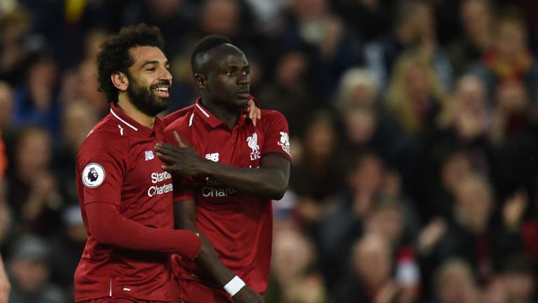Sadio Mane (right) celebrates with Liverpool's Mohamed Salah after scoring against Huddersfield