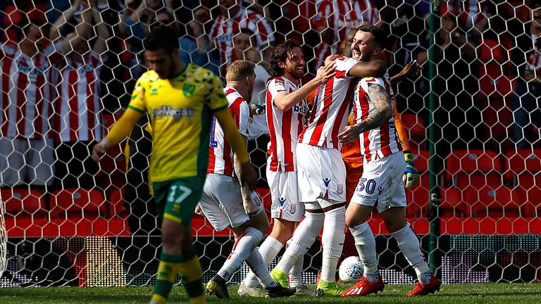 Stoke City's Tom Edwards (right) celebrates scoring his side's second goal against Norwich