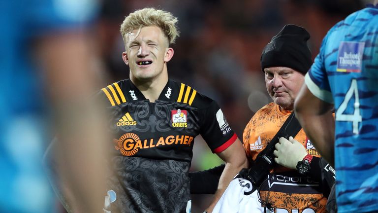 Damian McKenzie leaves the field after being injured playing for the Chiefs