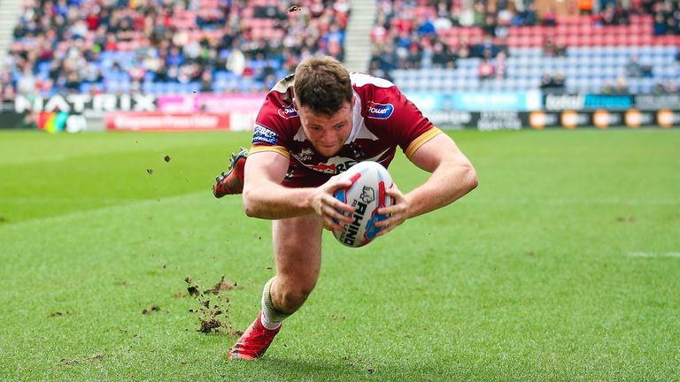 Wigan's Joe Burgess scored the opening try during a dramatic match