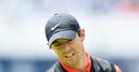 Late birdie gives McIlroy hope