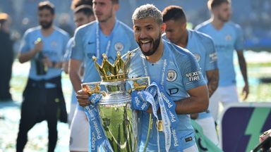 Manchester City's Sergio Aguero celebrates with the Premier League trophy