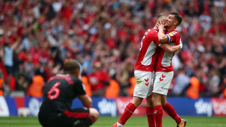 Charlton celebrate as Lee Cattermole looks dejected
