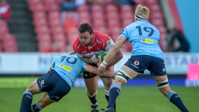 The Lions' Dylan Smith is tackled during the win over the Waratahs