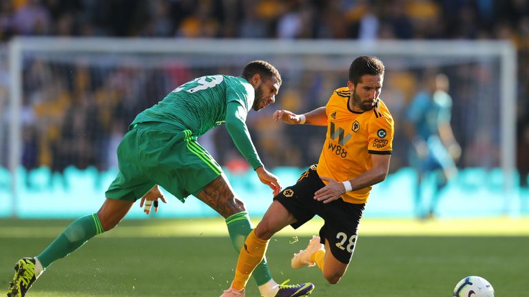 Watford's Etienne Capoue and Wolves' Joao Moutinho in action