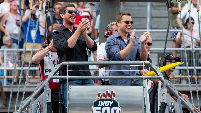 Actors Christian Bale and Matt Damon waved the green flag for the famous race