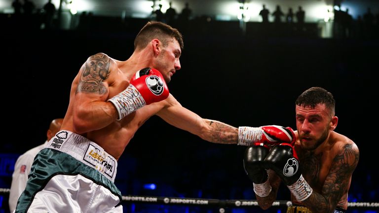 Wood catches Ryan Doyle with a left jab during their featherweight clash