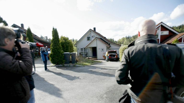 Photographers gather outside the home of Ovrebo the following day in Oslo
