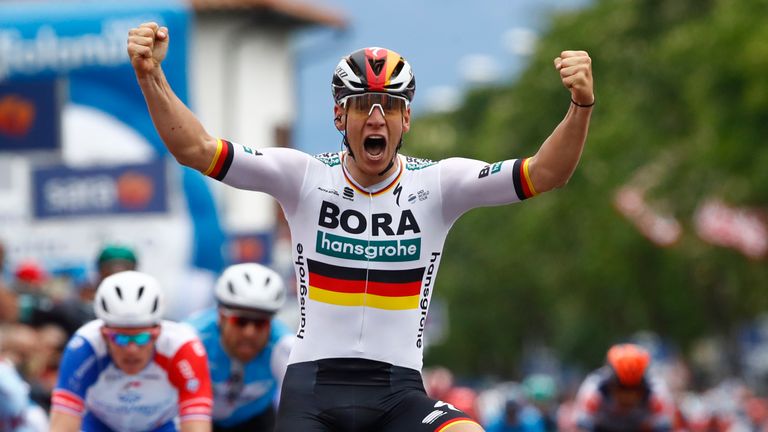 Pascal Ackermann celebrates his stage victory after a bunched sprint finish