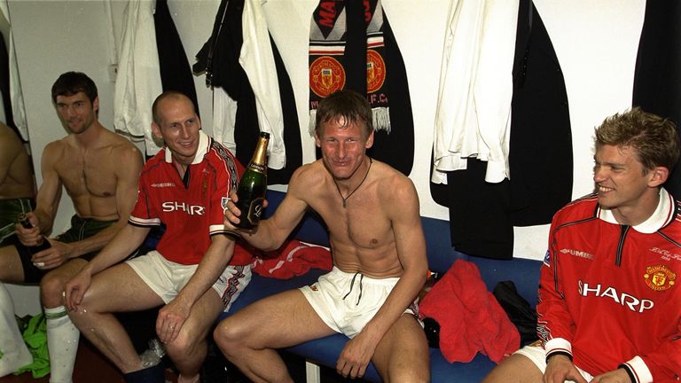 Sheringham celebrates in the dressing room afterwards