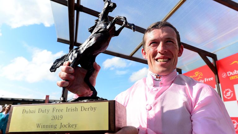 Jockey Padraig Beggy with the trophy after winning the Group 1 Dubai Duty Free Irish Derby on board Sovereign