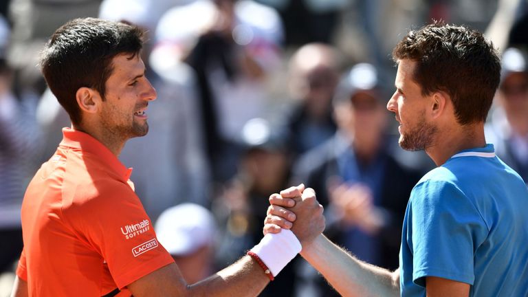 Djokovic congratulates Dominic Thiem at the net