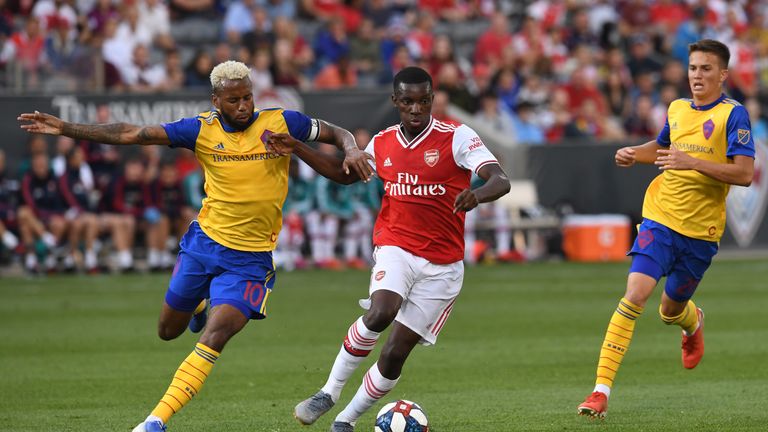 Arsenal forward Eddie Nketiah holds off Tyreece John-Jules of Colorado Rapids