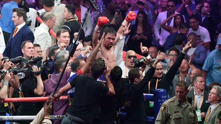 Manny Pacquiao celebrates after becoming the oldest welterweight in history