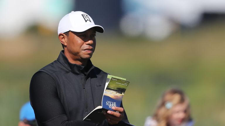 Woods had a chance to check out the greens alongside Patrick Reed