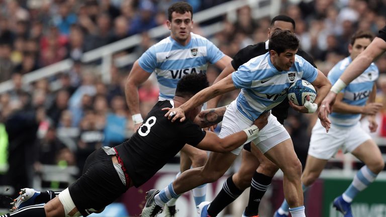 Tomas Cubelli looks to get through the tackle of Ardie Savea