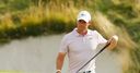 McIlroy avoids bunker penalty