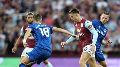 Aston Villa midfielder Jack Grealish competes for the ball with Everton's Gylfi Sigurdsson