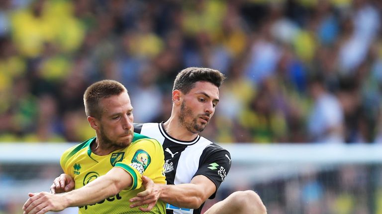 Marco Stiepermann and Fabian Schar compete for possession