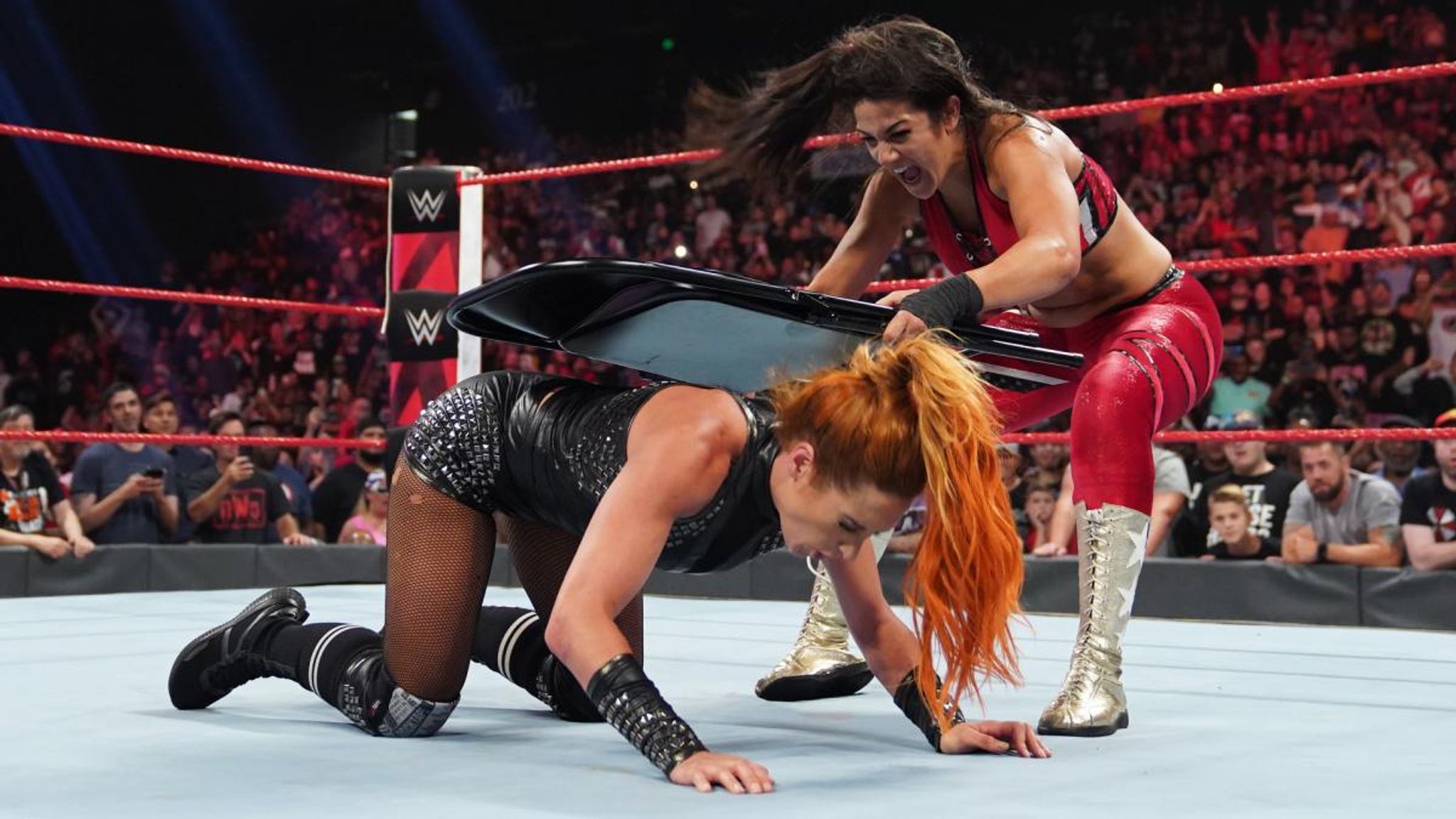 The 434 - Bayley vs Becky Lynch in a Steel Cage Match is canceled due to  Damage Control attacking Becky before the bell rang