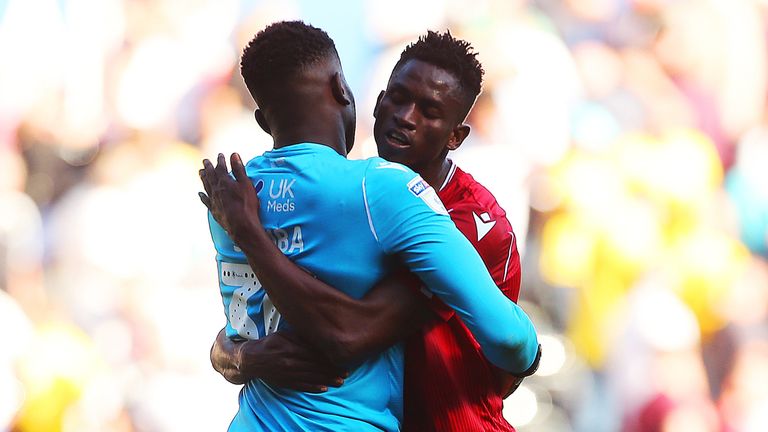 Alfa Semedo celebrates the win over Swansea with Brice Samba at full-time