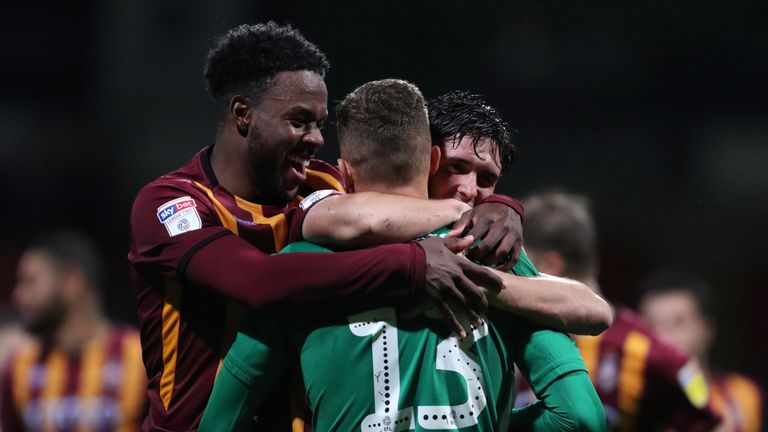 Bradford City's Sam Hornby goalkeeper is congratulated by team-mates after the victory