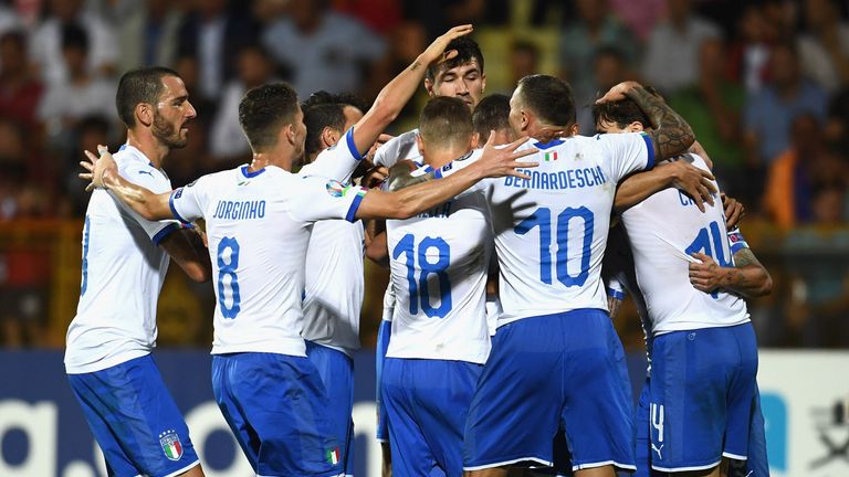 Andrea Belotti celebrates with team-mates after scoring for Italy