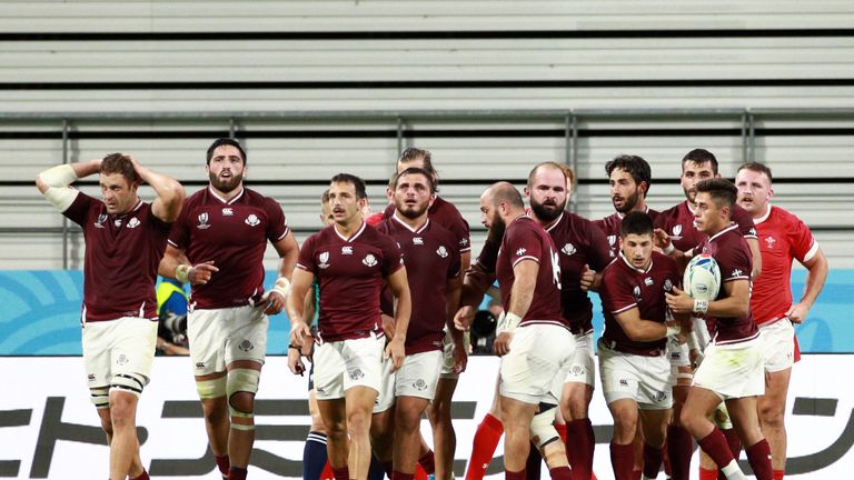 Levan Chilachava celebrates with his Georgia team-mates following his second-half try