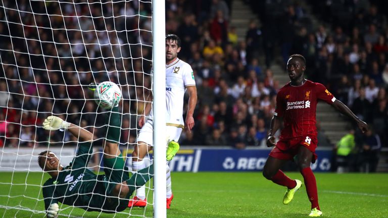 A goalkeeping howler from MK Dons' Stuart Moore saw Liverpool take the lead