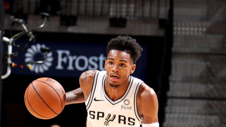 Dejounte Murray dribbles upcourt for the Spurs