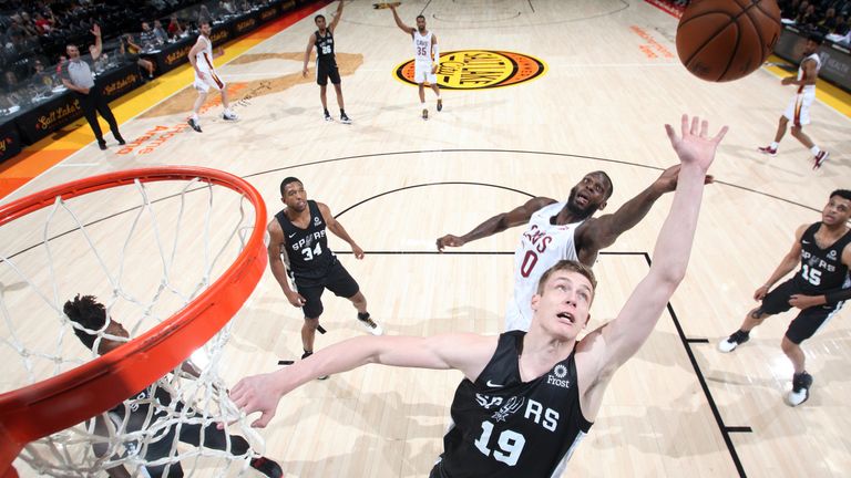 Spurs rookie Luka Samanic reaches for a rebound against Cleveland in Summer League