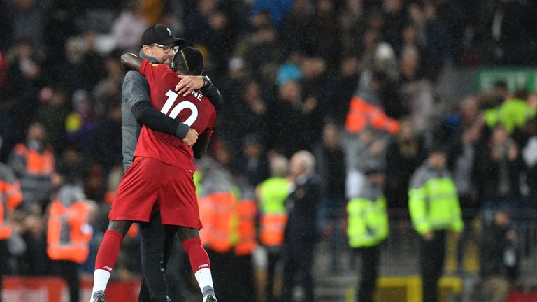 Klopp hugs Sadio Mane after the crucial victory