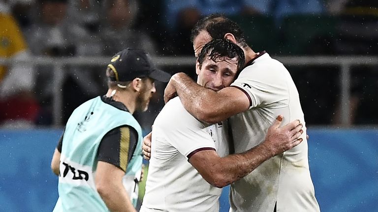 Georgia wing Alexander Todua celebrates his try with retiring Lelos legend Mamuka Gorgodze