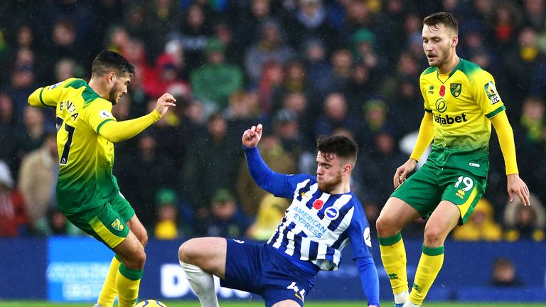 Brighton's Aaron Connolly tackles Emiliano Buendia of Norwich City 