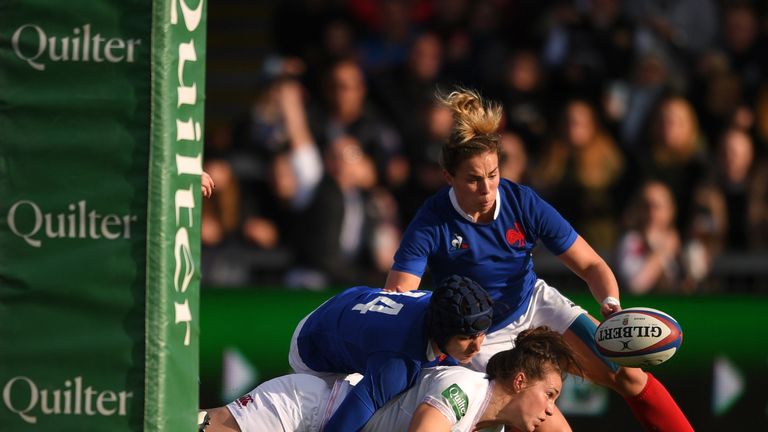 Emily Scarratt fails to ground the ball after a French covering tackle