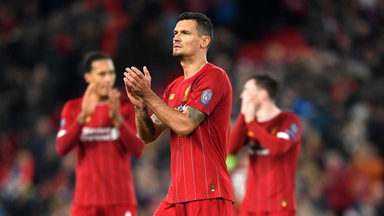 Dejan Lovren applauds the Liverpool support after the disappointing draw