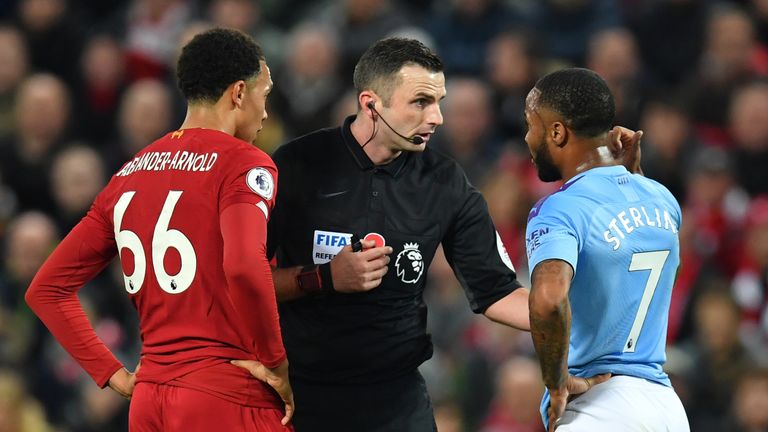 Referee Michael Oliver chats with Alexander-Arnold and City's Raheem Sterling