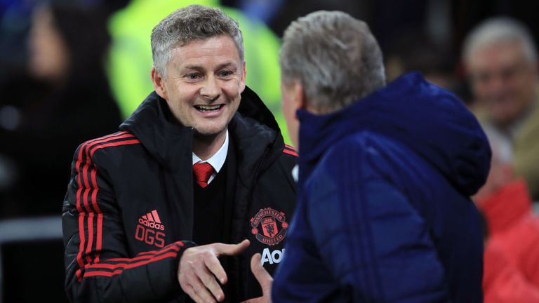 Ole Gunnar Solskjaer greets Cardiff manager Neil Warnock ahead of his first game in charge of Manchester United
