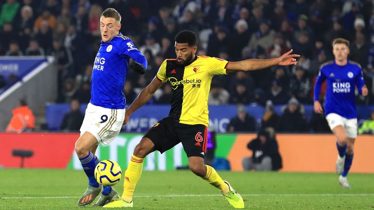 Jamie Vardy is challenged by Adrian Mariappa - but is booked for simulation