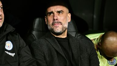 Pep Guardiola watches on from the dugout at the Bernabeu    