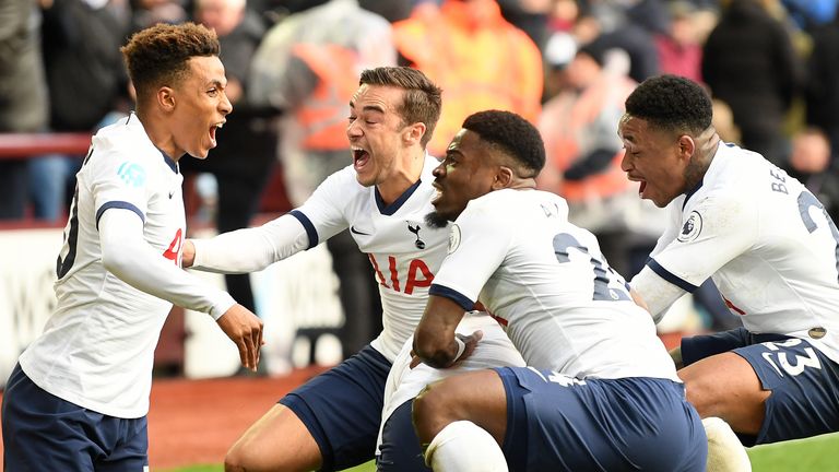 The Tottenham players celebrate Son's dramatic late winner at Villa Park