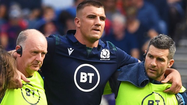 Sam Skinner is helped off during Scotland's World Cup warm-up win over France