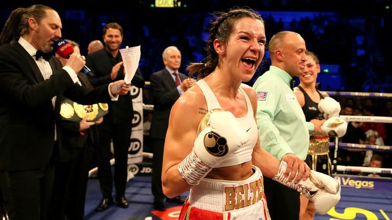 Harper celebrates her victory over Eva Wahlstrom in their WBC super-featherweight title fight at Sheffield's FlyDSA Arena in February