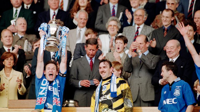Everton captain Dave Watson holds aloft the FA Cup alongside Southall