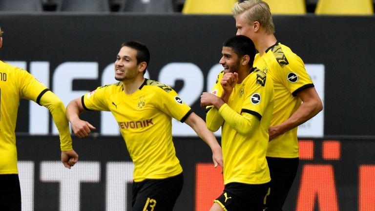 Raphael Guerreiro celebrates with team-mates after scoring Dortmund's second just before half-time