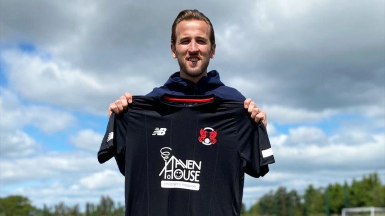Harry Kane holding one of the Leyton Orient shirts he has sponsored