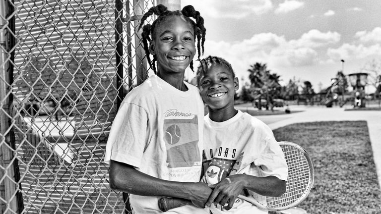Venus Williams (L), 11, and Serena, 9, outside Compton tennis courts, south central LA in 1991