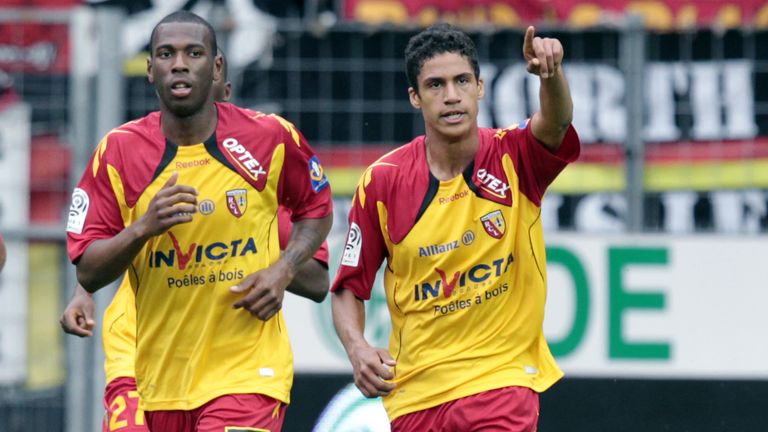 Raphael Varane (right) was being tracked by Arsenal at Lens, before his big-money move to Real Madrid
